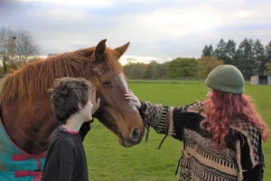 Young people with horse at Elysian.